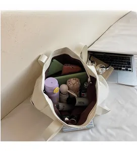 Macro view of white leather tote bag interior showing large capacity and brown lining
