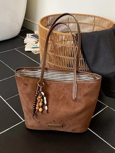 Vintage brown suede tote bag with leather straps and retro wooden bead accessory