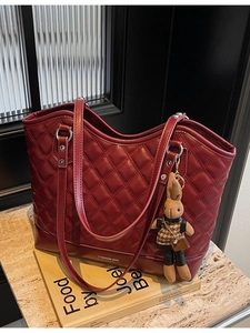 Vintage burgundy quilted tote bag with diamond stitching and cute rabbit charm decoration