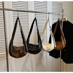 Fashionable half-moon hobo bags in four colors with adjustable wide shoulder straps
