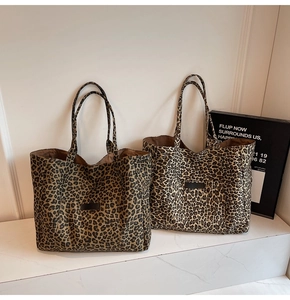 Detailed comparison of two leopard print canvas tote bags with premium leather labels