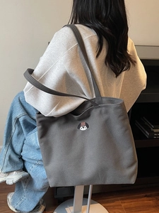 Spacious dark grey canvas tote bag with a small dog embroidery for casual daily commute