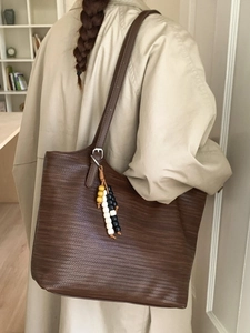 Retro brown woven tote bag with beaded pendant and leather strap for women