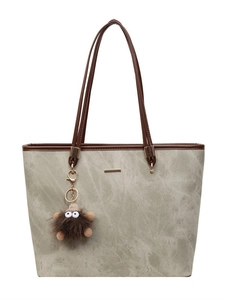 Women's textured stone-pattern tote bag in grey-green with brown straps and monster charm