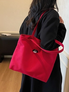 Red canvas tote bag for women featuring a cute cartoon dog embroidery and large capacity