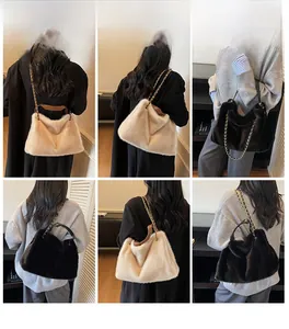Detail view of stylish faux fur handbags in beige and black with gold metal chains