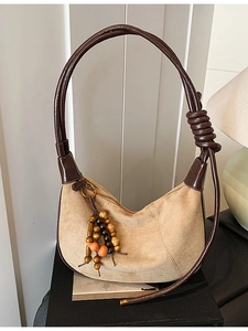 Retro khaki suede crescent shoulder bag with unique braided strap and bead charms