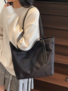 Large capacity black nylon tote bag with white contrast stitching for women's daily commute