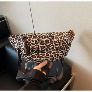 Detail of leopard print waist bag showing durable canvas texture and adjustable strap