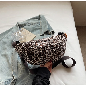 Detailed shot of leopard print waist bag with diamond quilting and wide shoulder strap