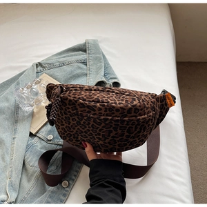 Detail of leopard print waist bag with MULAIDI orange label and adjustable nylon strap