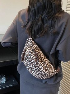 Leopard print crossbody chest bag with canvas texture and woven zipper pullers
