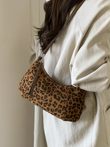 Retro leopard print suede crossbody bag styled with a beige trench coat for women