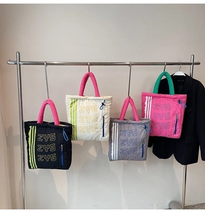 Quilted nylon tote bags in multiple colors with contrast handles and side zipper details