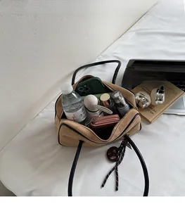Spacious interior of beige suede tote bag showing large capacity for daily essentials