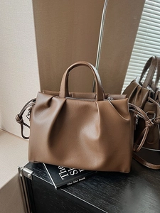 Brown leather tote bag with pleated design and circular handles for women