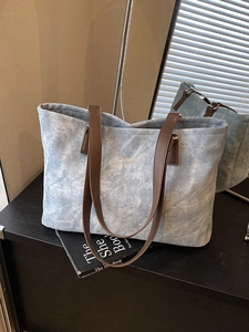 Light blue large capacity tote bag with brown faux leather straps and matte finish