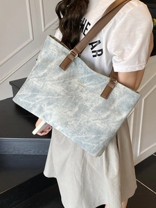Light blue marble pattern tote bag with brown leather straps for commuting