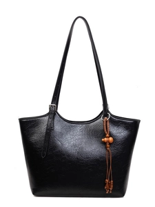 Retro black tote bag in glossy wrinkled leather with vintage decorative wood bead charm