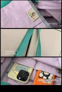 Detail of green tote bag with purple lining featuring logo label and internal phone pocket