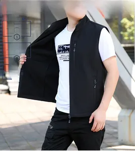 Detail of men's black softshell vest featuring standing collar and functional zipper pockets