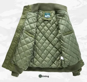 Detail view of the diamond quilted inner lining and internal pocket of the bomber jacket