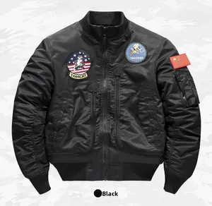 Detail view of black bomber jacket with tactical patches and utility sleeve pocket