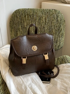 Retro dark brown leather backpack with golden twist lock and荔枝 texture for women