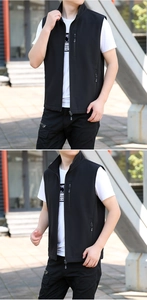Detail of black softshell outdoor vest with high collar and multiple functional zip pockets