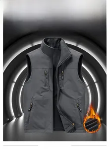 Detail of reversible fleece-lined men's outdoor vest with four zipper pockets and stand collar