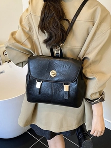 Retro black leather backpack for women with gold twist lock and sleek Korean fashion style