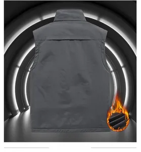 Detail view of the back of a windproof gray vest with high-tech fleece thermal lining