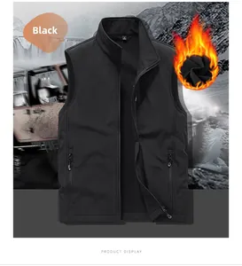 Detail of waterproof black outdoor softshell vest showing fleece lining and zip pockets