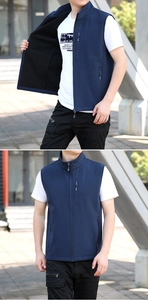 Detail view of navy softshell vest featuring warm fleece lining and functional zip pockets