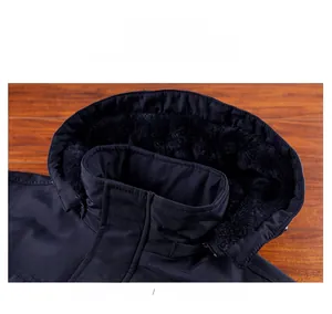 Detail view of hood neckline with thick black faux fur lining and windproof fabric