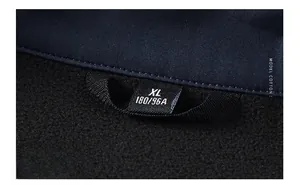 Detail of softshell vest inner fleece lining and collar size label in XL