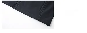 Detail shot of black casual vest hem showing premium stitching and smooth zipper closure