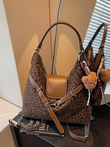 Vintage leopard print tote bag with brown leather trim and cute bear keychain accessory
