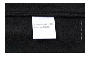 Close-up of vest care label showing polyester and spandex fabric blend composition