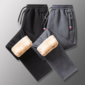 Detail of premium corduroy jacket cuff featuring warm fleece lining and subtle red accents