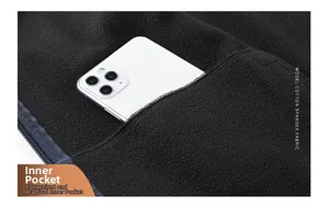 Detail view of functional inner pocket on a warm softshell vest with cotton spandex fabric