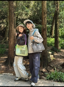 Detailed view of large canvas tote bags with mesh pockets for outdoor hiking and leisure