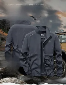 Detailed view of dark grey outdoor jacket featuring shoulder prints and elastic cuffs