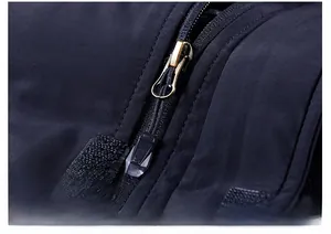 Detail of high-quality metal zipper and windproof fabric on men's winter padded jacket