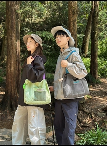 Detail of waterproof nylon tote bags with mesh pockets for outdoor activities