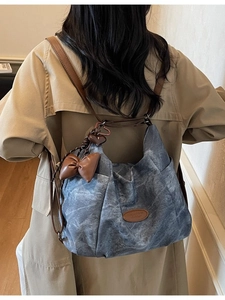 Retro blue denim large capacity backpack with brown leather straps and charms