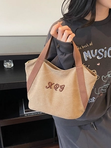 Stylish khaki canvas tote bag with brown handles and embroidered XQG logo for daily use