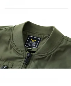 Close-up of military bomber jacket collar with rib-knit neckline and metal zipper