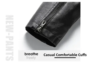 Close-up of black leather jacket cuff featuring a metallic zipper and lychee texture