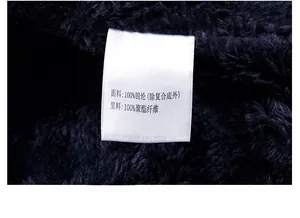 Detail of internal fleece lining and fabric composition label on men's winter coat